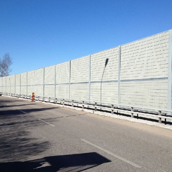 Several pieces of micro expanded metal noise barriers are installed on the highway